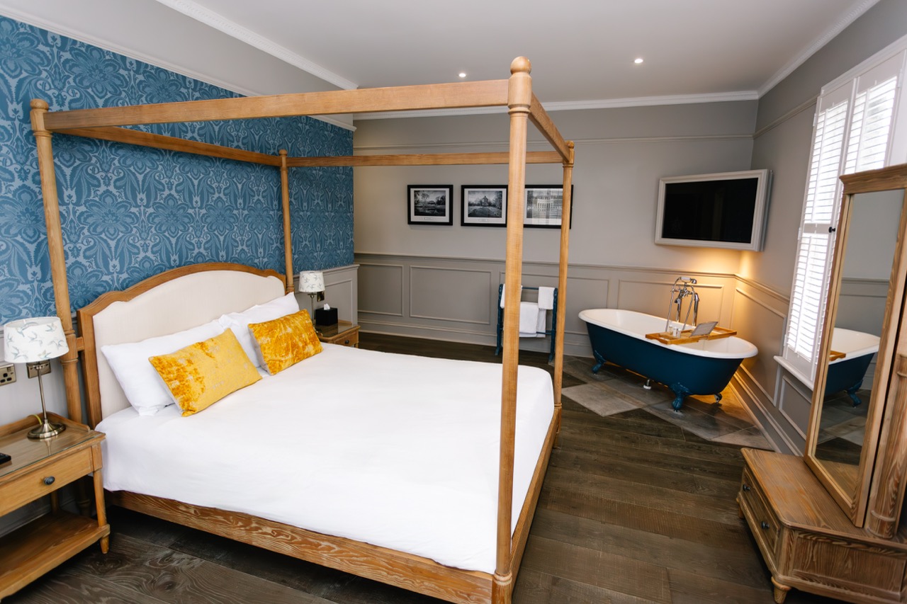 Cotswold suite bedroom with a four poster bed