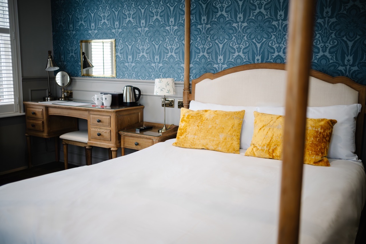Cotswold suite bedroom with a four poster bed