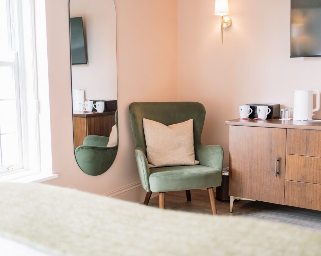 Chair in the corner of the newly refurbished heritage room at hatton court hotel.