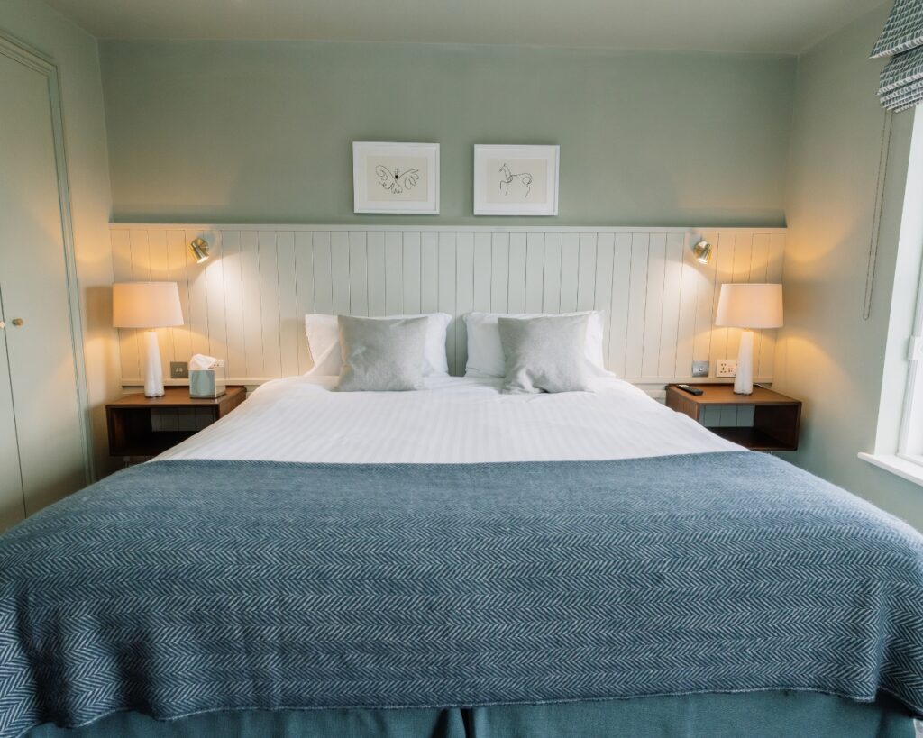 Newly refurbished heriatage room at hatton court hotel with a king sized bed.