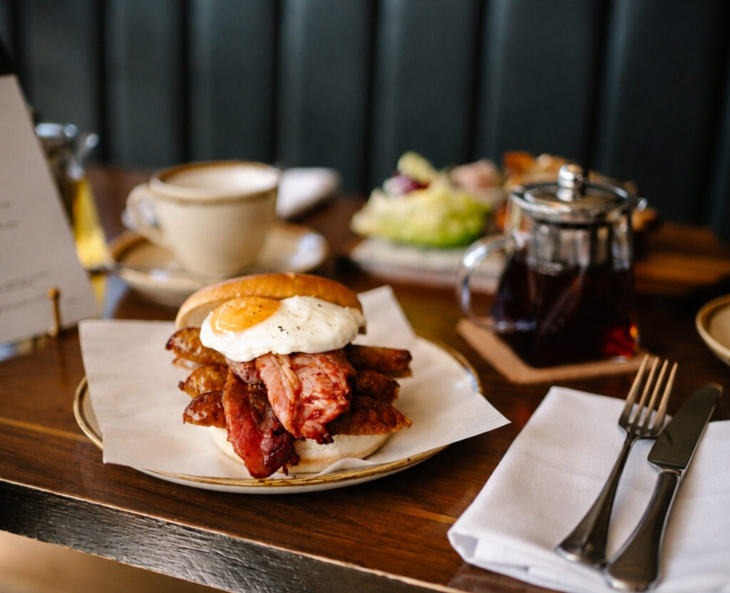 full breakfast roll with bacon sausage and egg served in the tara restaurant at hatton court hotel