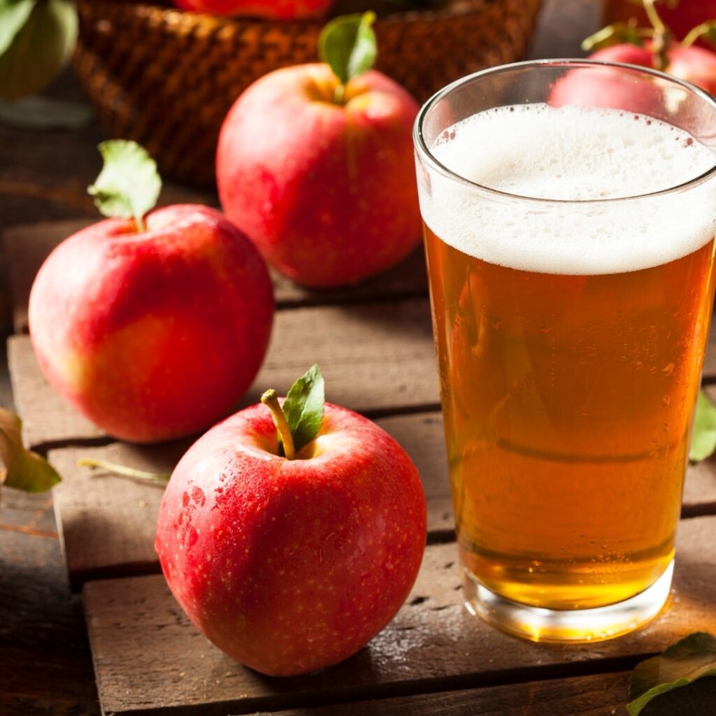Cider and apples on a table from dunkertons cider